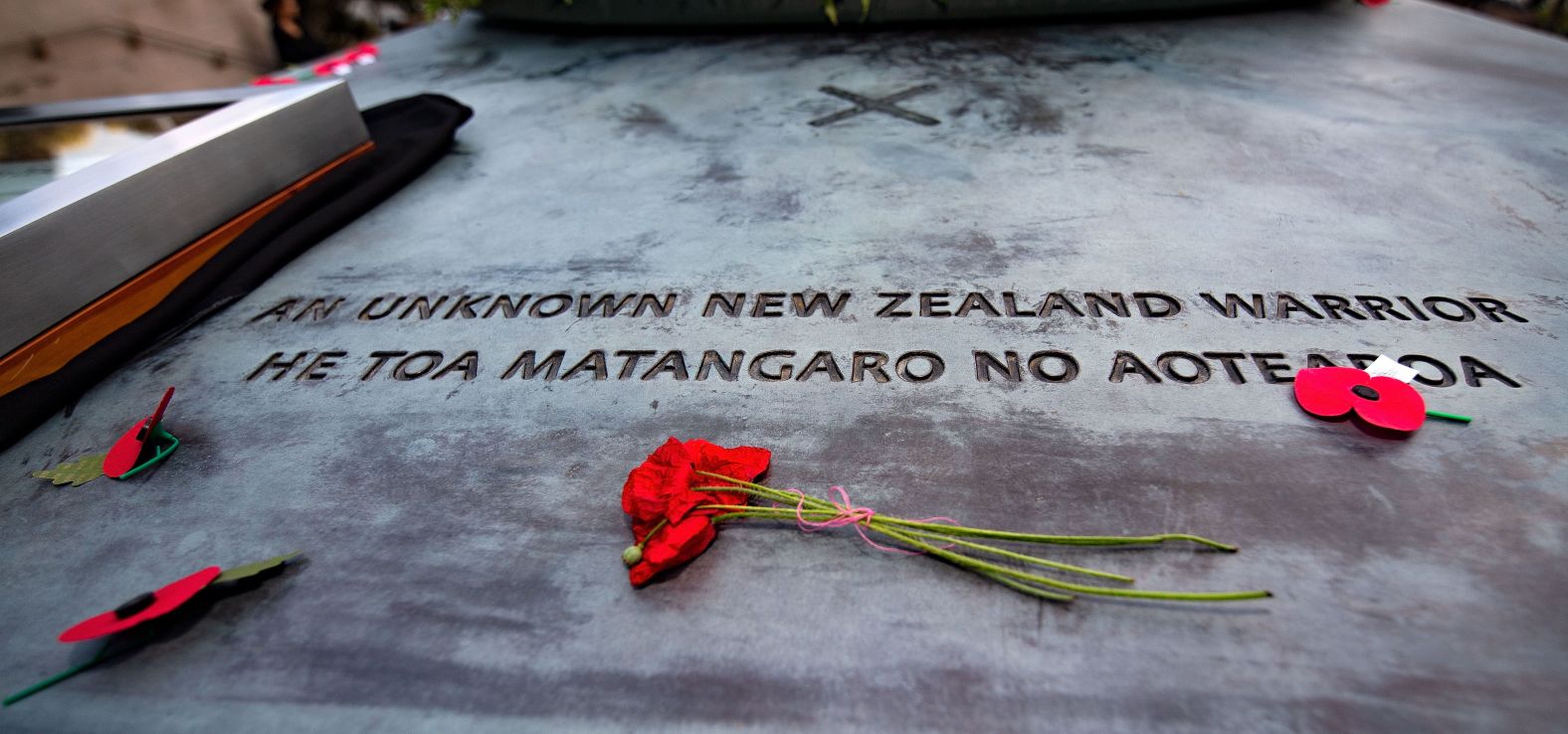 Poppies lie on the tomb during a Mounting of the Vigil and dressing of the Tomb of the Unknown Warrior commemoration starting the ceremony  at the National War Memorial in Wellington, New Zealand on Sunday.