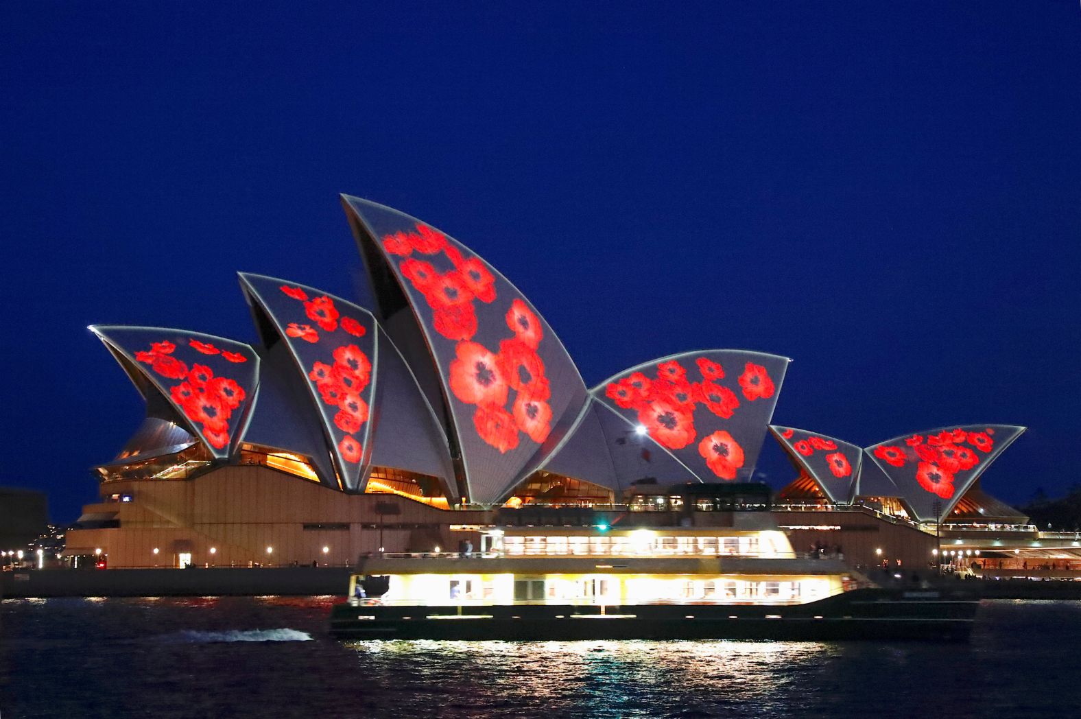 A ferry passes in front of the Sydney Opera House Sunday as red poppies are projected onto the sails to mark the centenary of the Armistice ending World War I. 