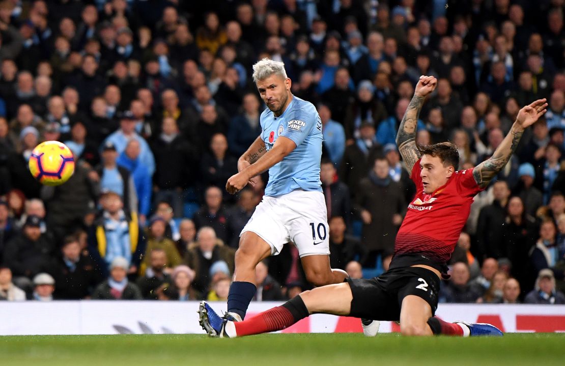 Sergio Aguero blasts home Manchester City's second goal early in the second half under challenge from Victor Lindelof of Manchester United.