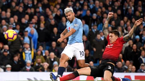 Sergio Aguero blasts home Manchester City's second goal early in the second half under challenge from Victor Lindelof of Manchester United.