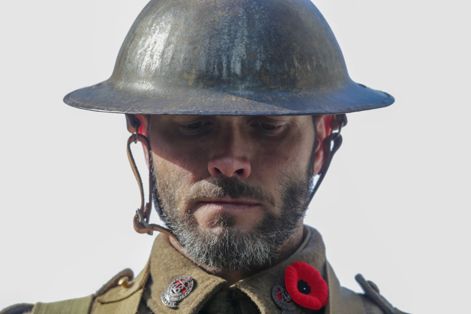 A Canadian soldier wearing a uniform dating to World War I guards a monument during a ceremony in Toronto on Sunday.