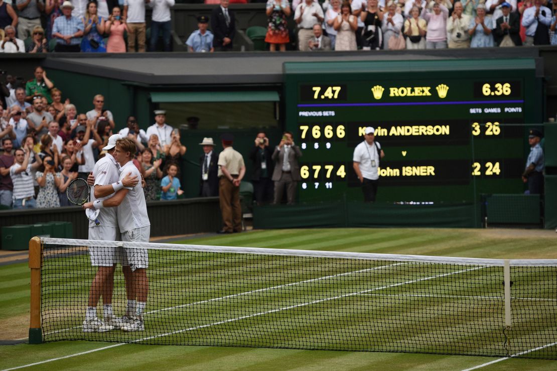 Kevin Anderson (right) and John Isner hug at the net after their six-and-a-half hour Wimbledon semifinal in July. 