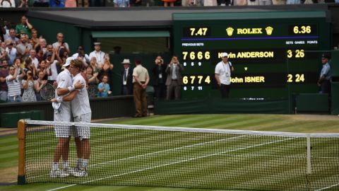 Kevin Anderson (right) and John Isner hug at the net after their six-and-a-half hour Wimbledon semifinal in July. 