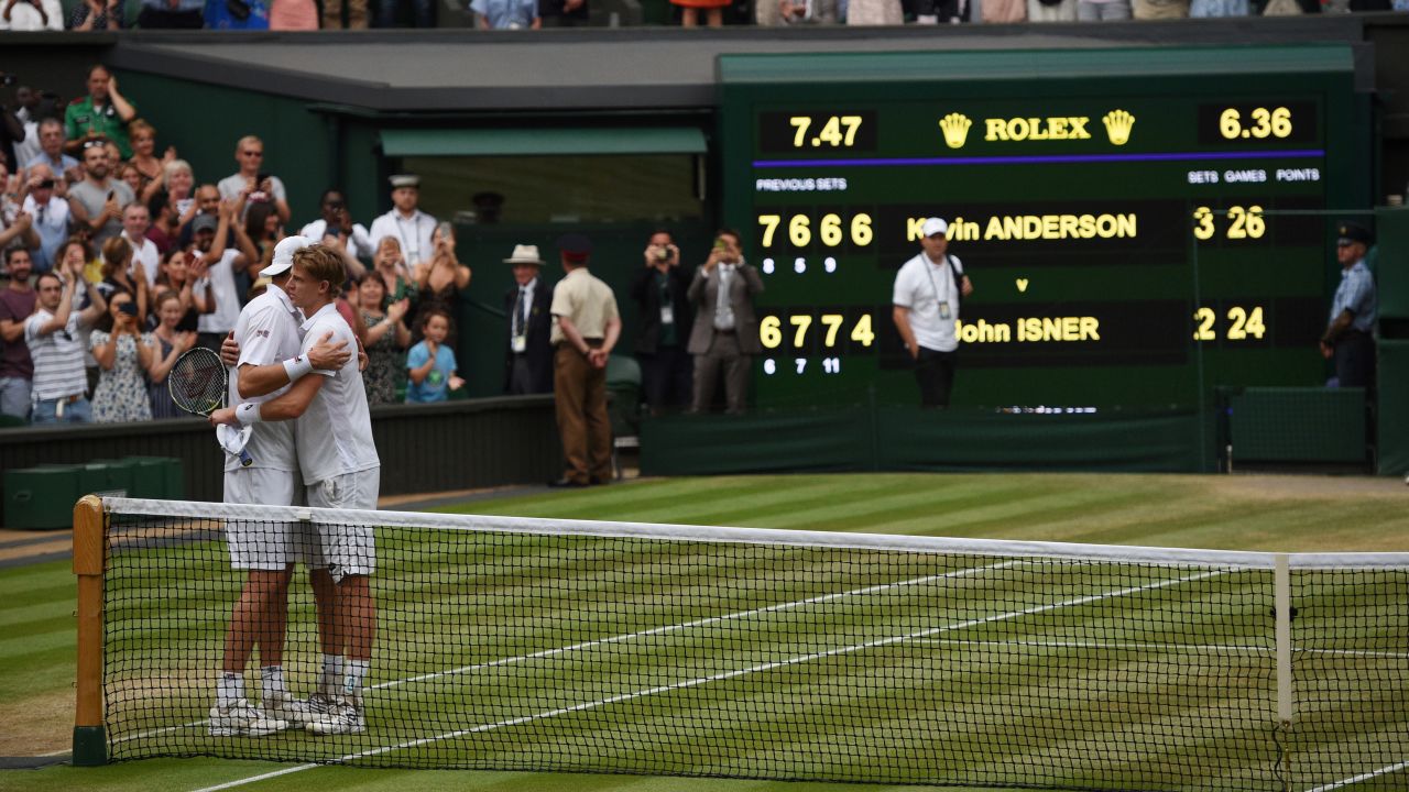 Kevin Anderson (right) and John Isner hug at the net after their six-and-a-half hour Wimbledon semifinal in July.