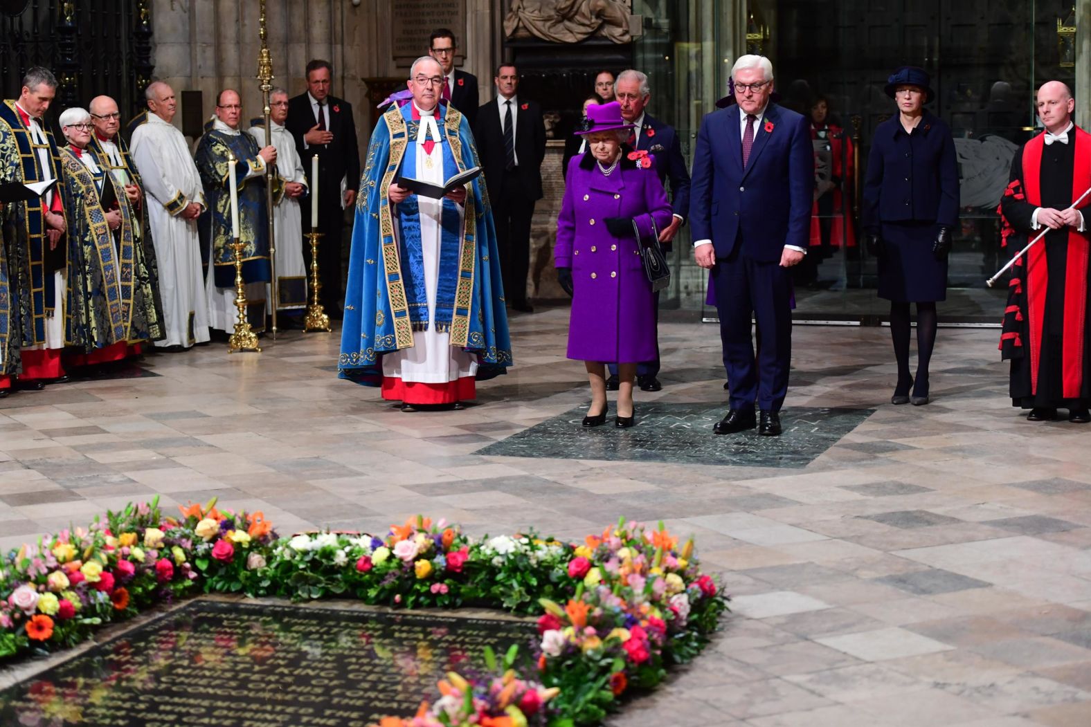 Queen Elizabeth II and German President Frank-Walter Steinmeier stand in front of the grave of the unknown warrior as they attend a service marking the armistice at Westminster Abbey on Sunday in London.