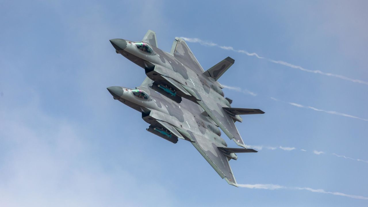 ZHUHAI, CHINA - NOVEMBER 11: Fighter aircraft J-20 of People's Liberation Army Air Force (PLAAF) perform in the sky showing with live ammunition for the first time on day six of the Airshow China 2018 on November 11, 2018 in Zhuhai, Guangdong Province of China. The Airshow China 2018 ends on Sunday in Zhuhai as China marks the 69th anniversary of the PLAAF's founding. (Photo by VCG/VCG via Getty Images)