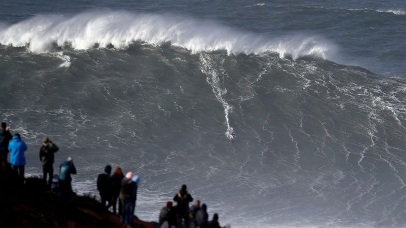 Big wave surfer Sebastian Steudtner of Germany rides a large wave at Praia do Notre on November 9, in Nazare, Portugal.