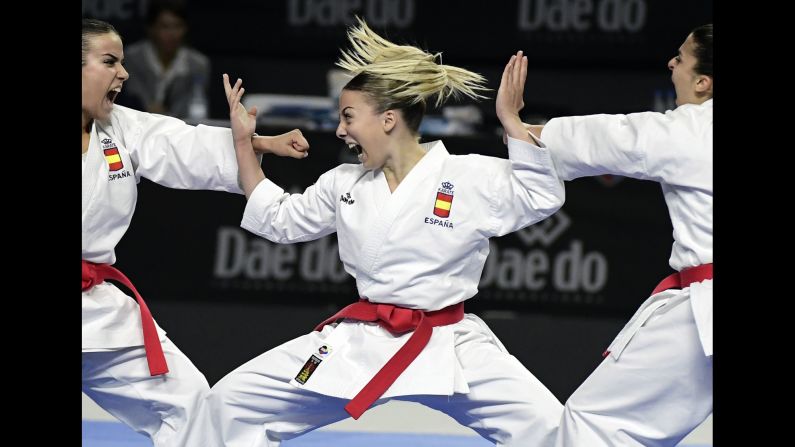 Spain's Lidia Rodriguez, Marta Garcia and Raquel Roy compete in the Kata team female final during the 24th Karate World Championships in Madrid on November 11.