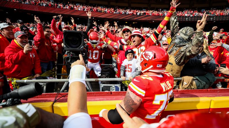 Tyreek Hill of the Kansas City Chiefs takes over a television camera in celebration after scoring his second touchdown of the game against the Arizona Cardinals at Arrowhead Stadium in Kansas City, Missouri on November 11. Hill was penalized for unsportsmanlike conduct as a result of the stunt.