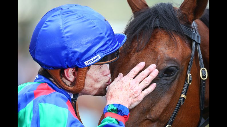 Jockey Craig Williams kisses his horse Cochada after winning the Melbourne Cup Carnival Country Final during Oaks Day at Flemington Racecourse on November 8 in Melbourne, Australia.