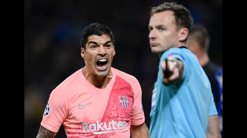 Barcelona forward Luis Suarez reacts to a referee's decision during a Champions League football match between Inter Milan and Barcelona on November 6 in Milan, Italy. 