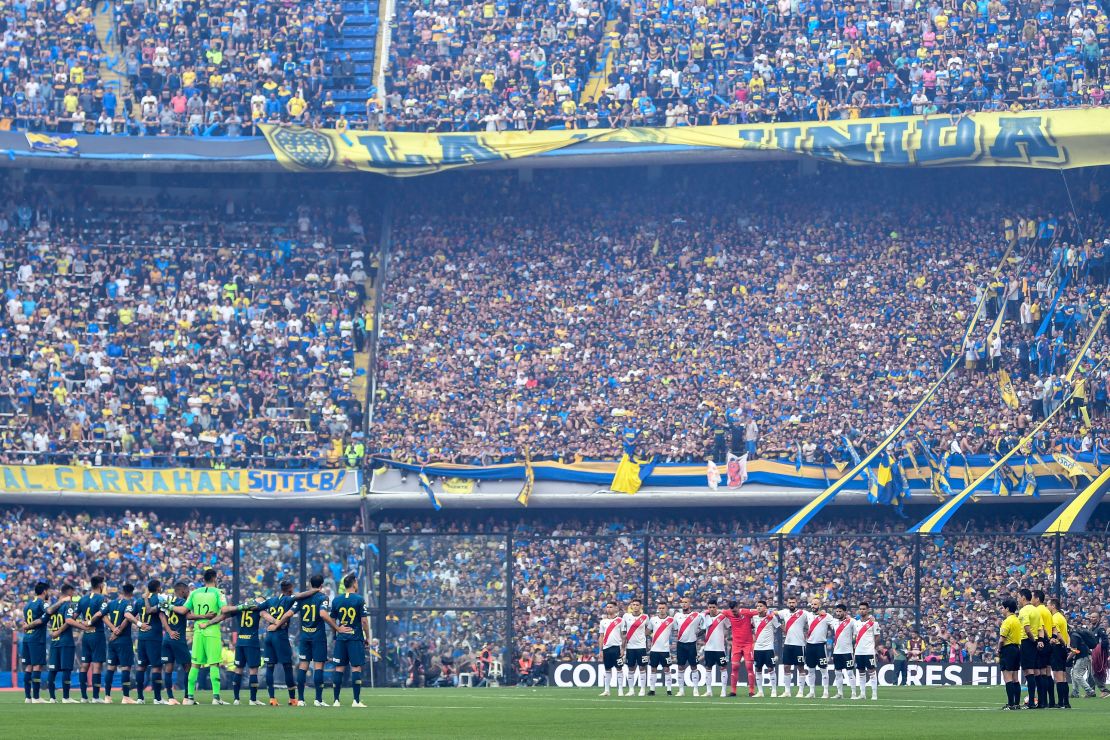 Boca Juniors and River Plate line up ahead of the first leg of the Copa Liberdatores final first leg at the Bombonera stadium in Buenos Aires. 