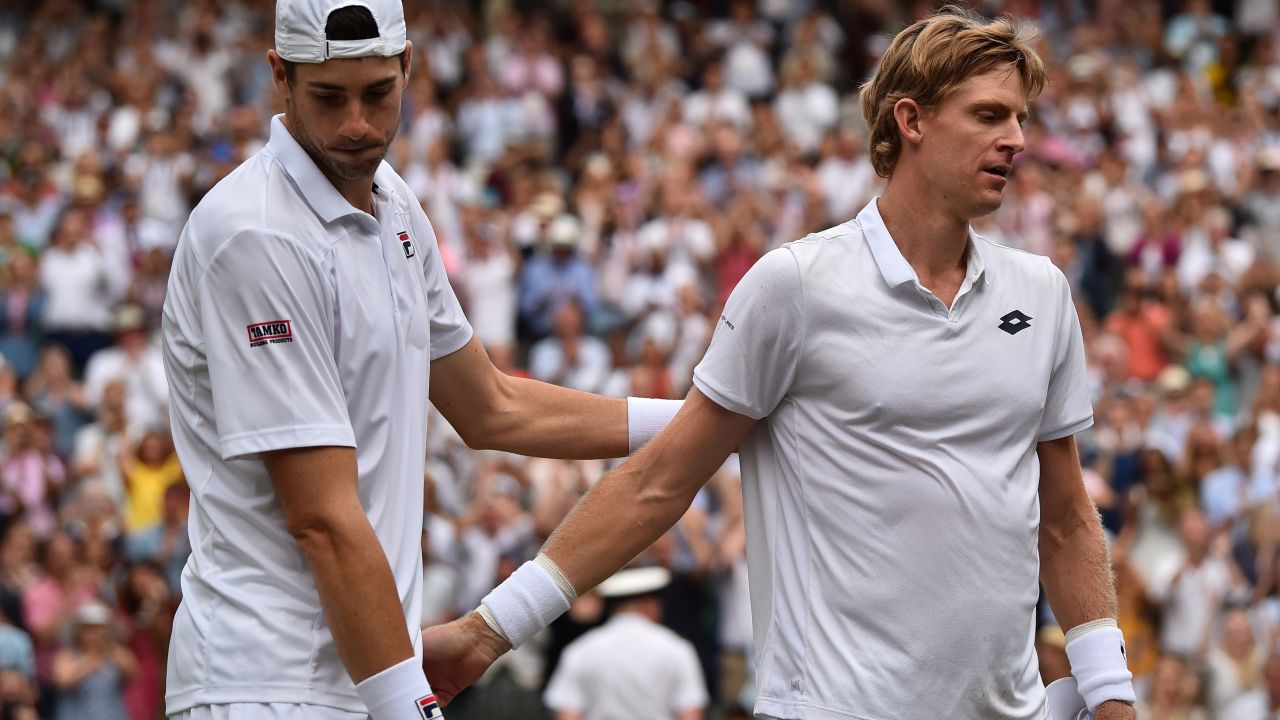 South Africa's Kevin Anderson (R) shakes hands after beating Isner in their six-and-a-half hour Wimbledon epic earlier in the year. 