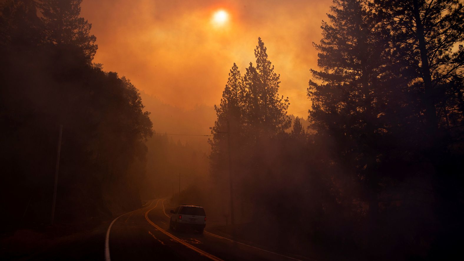 A vehicle drives through smoke near Pulga on Sunday, November 11.