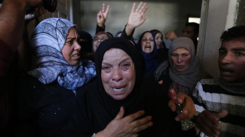 Relatives mourn a Palestinian man killed in an Israeli airstrike in Khan Younis, Gaza, on Monday. 