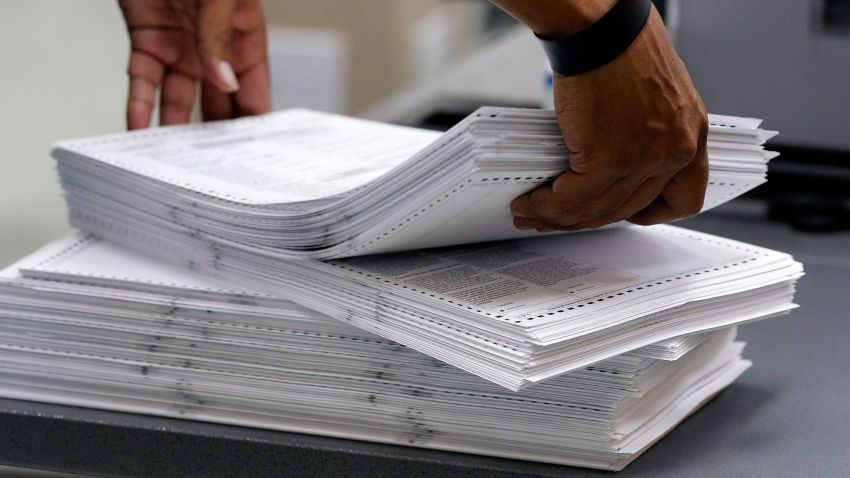 LAUDERHILL, FL - NOVEMBER 11: Elections staff load ballots into machine as recounting is underway at the Broward County Supervisor of Elections Office on November 11, 2018 in Lauderhill, Florida. A statewide vote recount is being conducted to determine the races for governor, Senate, and agriculture commissioner. (Photo by Joe Skipper/Getty Images)