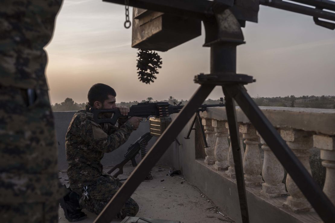 YPG fighters are seen on the frontline on October 18, in Baghoz, Syria, during an operation to retake the last stronghold of ISIS in Syria.