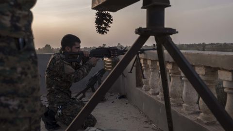 YPG fighters are seen on the frontline on October 18, in Baghoz, Syria, during an operation to retake the last stronghold of ISIS in Syria.