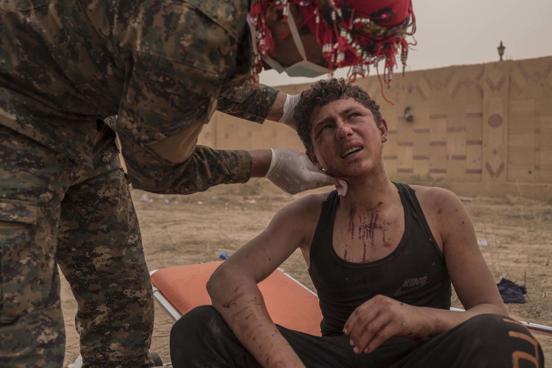 A young SDF soldier receives first aid on the frontline during the operation in Sousa, on October 25.