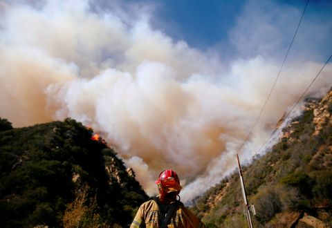 Firefighters battle the Woolsey Fire in Malibu on November 11.