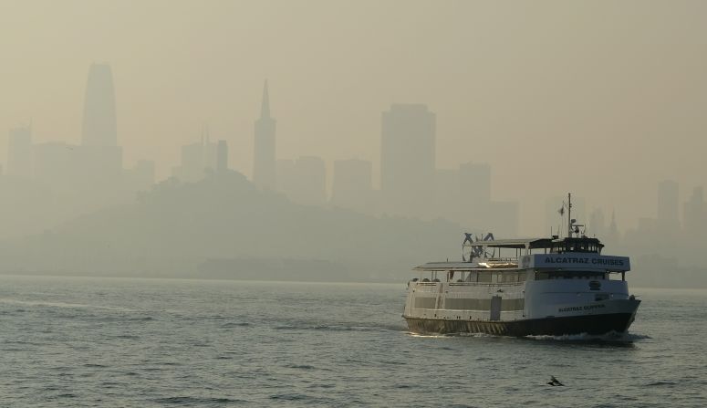 A ferry makes its way toward Alcatraz Island on November 12 as the San Francisco skyline is obscured by smoke that drifted over from the Camp Fire.