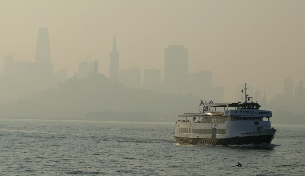 A ferry makes its way toward Alcatraz Island on November 12 as the San Francisco skyline is obscured by smoke that drifted over from the Camp Fire.