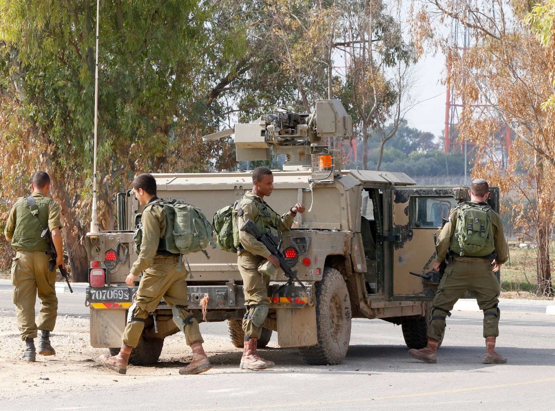 Israeli soldiers arrive near the Gaza fence on Monday. 