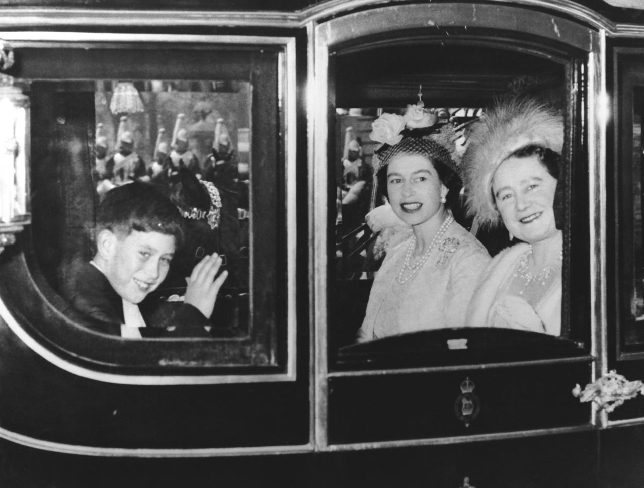 Charles rides with his mother and grandmother as they travel to Westminster Abbey for the wedding of Princess Margaret in May 1960.