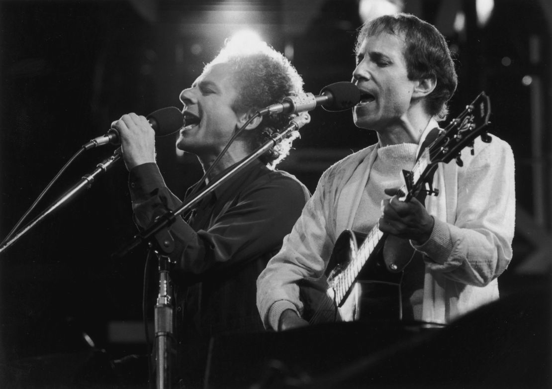 Simon and Garfunkel perform during a reunion concert at London's Wembley Stadium in 1982.