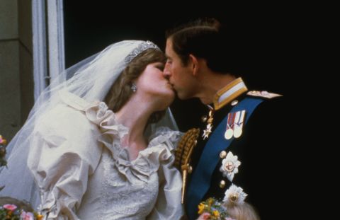 Prince Charles kisses his first wife, Lady Diana Spencer, on the balcony of Buckingham Palace in July 1981. Their wedding ceremony was televised.