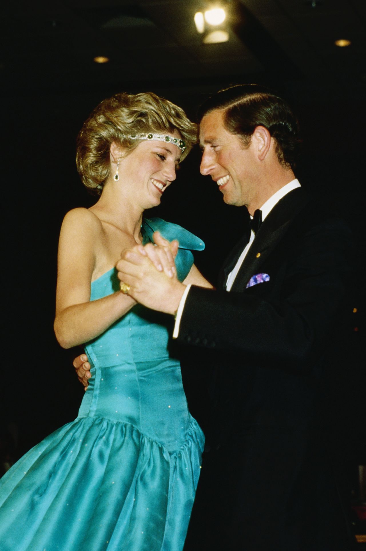 Charles and Diana dance together at a formal event.