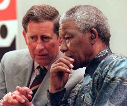 South African President Nelson Mandela talks with Prince Charles in London in July 1996.