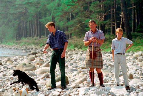Prince Charles and his sons spend time together at the Balmoral Castle estate in Balmoral, Scotland, in August 1997.