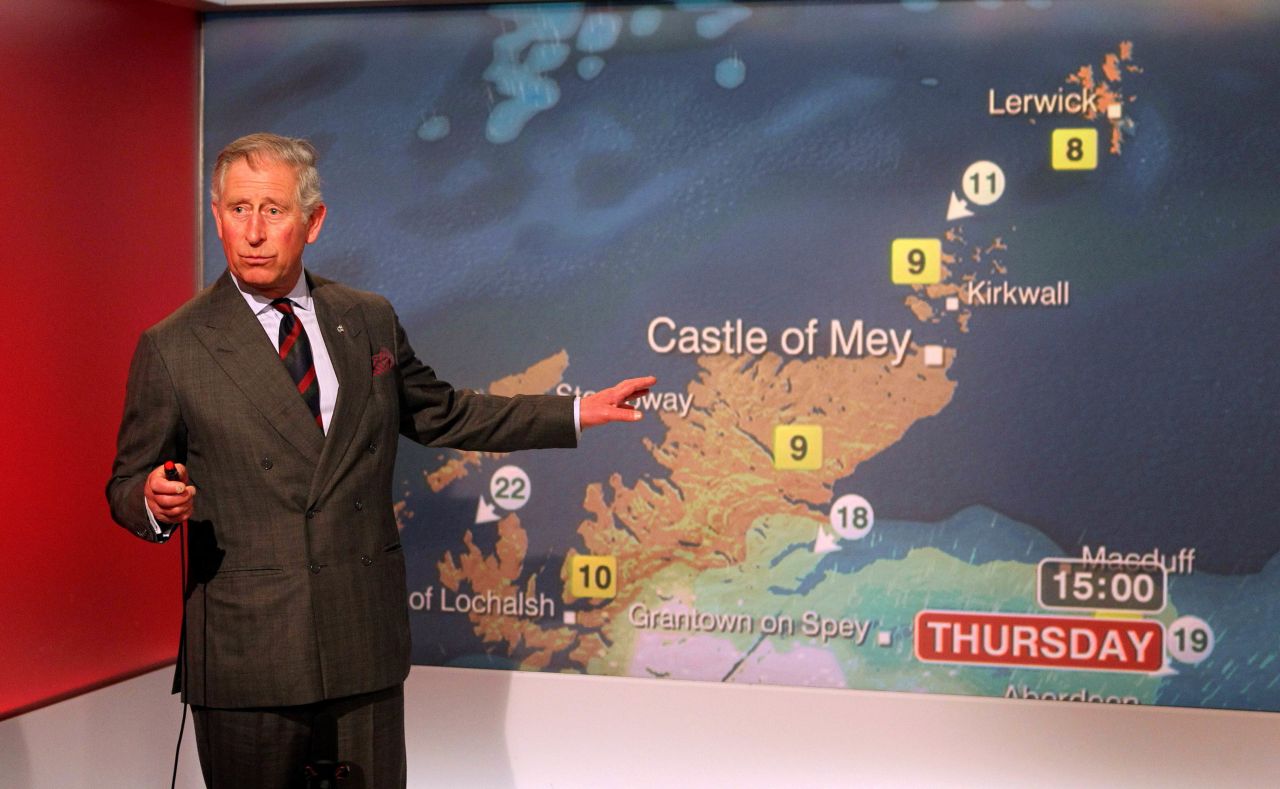Charles reads the weather while touring BBC Scotland's headquarters in May 2012.