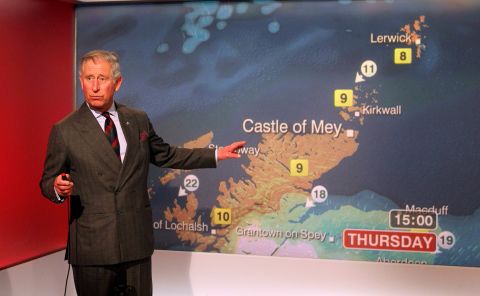 Prince Charles reads the weather while touring BBC Scotland's headquarters in May 2012.