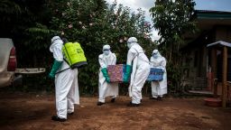 Health workers carry out the body of a patient with unconfirmed Ebola virus on August 22, 2018 in Mangina, near Beni, in the North Kivu province. - Sixty-one people have died in the latest outbreak of Ebola in the Democratic Republic of Congo (DRC), the authorities said, adding that four novel drugs had been added to the roster of treatments. The outbreak began on August 1 in Mangina, the epicentre of the outbreak in the North Kivu province, and cases have been reported in neighbouring Ituri province. It is the 10th outbreak to strike the DRC since 1976, when Ebola was first identified and named after a river in the north of the country. (Photo by John WESSELS / AFP)        (Photo credit should read JOHN WESSELS/AFP/Getty Images)