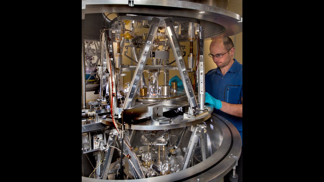 Scientist preparing the International Bureau of Weights and Measures Kibble balance for a measurement