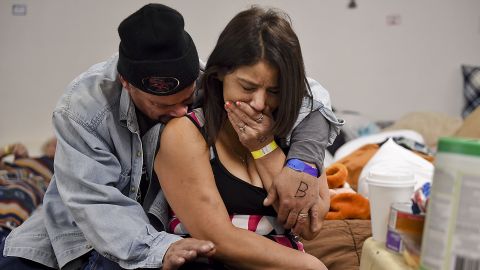 Joseph Grado embraces his wife, Susan, at a shelter this week in Chico after losing their home to fire.