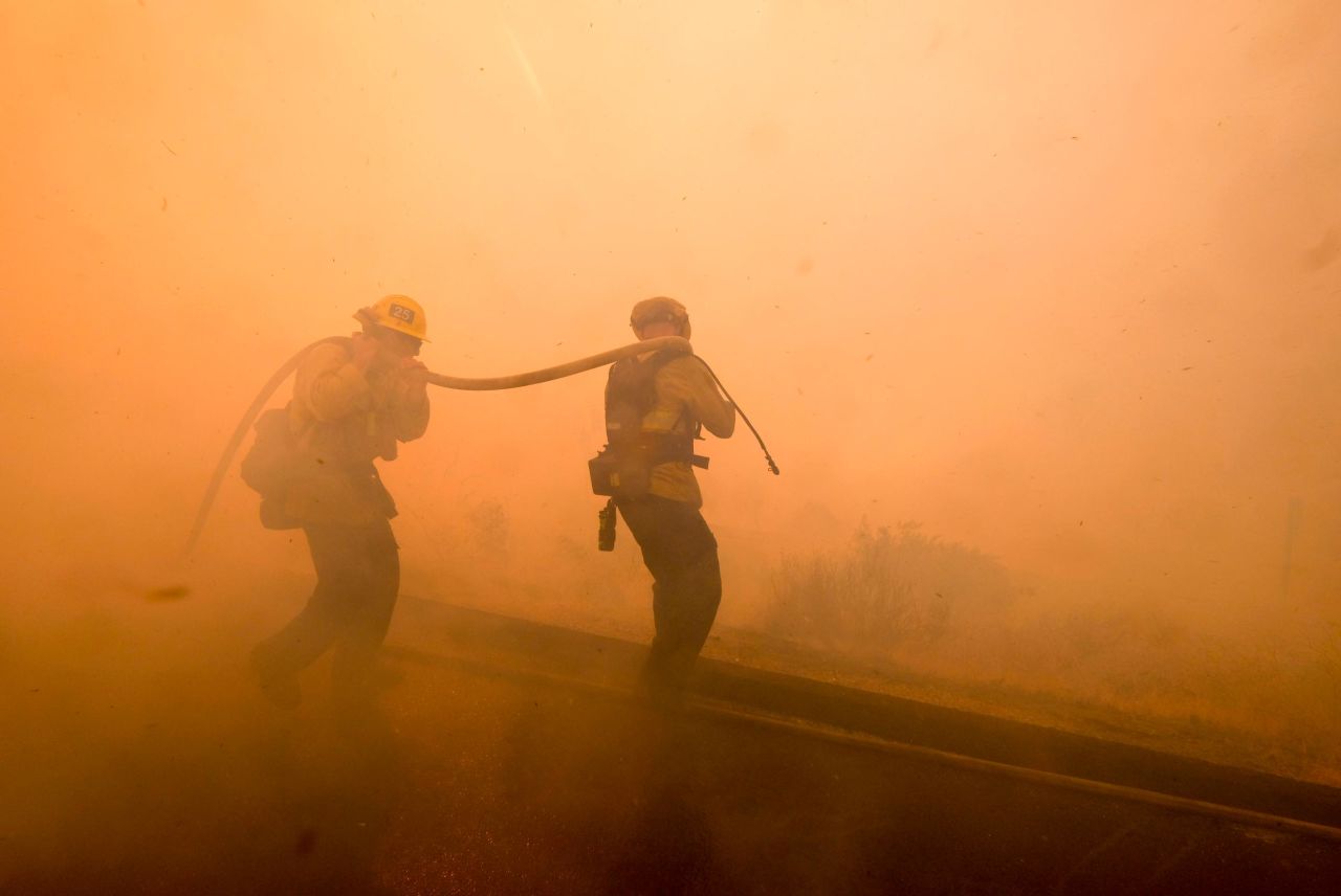 Firefighters battle a fire in Simi Valley on November 12.