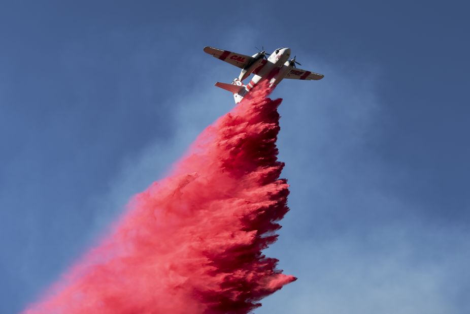 A plane drops fire retardant on the Woolsey Fire near Malibu on November 12.