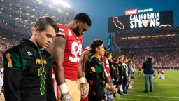 November 12, 2018; Santa Clara, CA, USA; San Francisco 49ers defensive tackle DeForest Buckner (99) and Paradise High School football players during a moment of silence before the game against the New York Giants at Levi's Stadium. Mandatory Credit: Kyle Terada-USA TODAY Sports