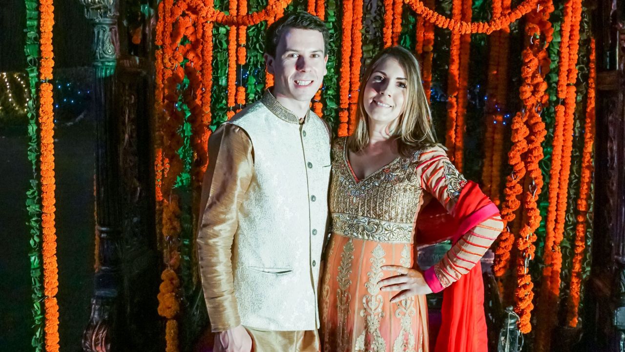 Carly Stevens (right) and her fiance Tim Gower attended an Indian wedding through JoinMyWedding in November 2017.