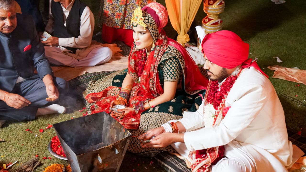 <strong>Colorful rituals</strong>: The couple attended Amarjeet and Surahabi's wedding (pictured) in Delhi in November 2017. "I wanted to experience the colorful rituals, grand feasting and traditional ceremonies," says Stevens.