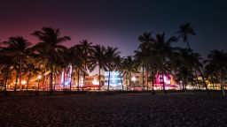 Ocean Drive street with illuminated buildings in Miami , Florida. Vintage colors; Shutterstock ID 539505175; Job: -