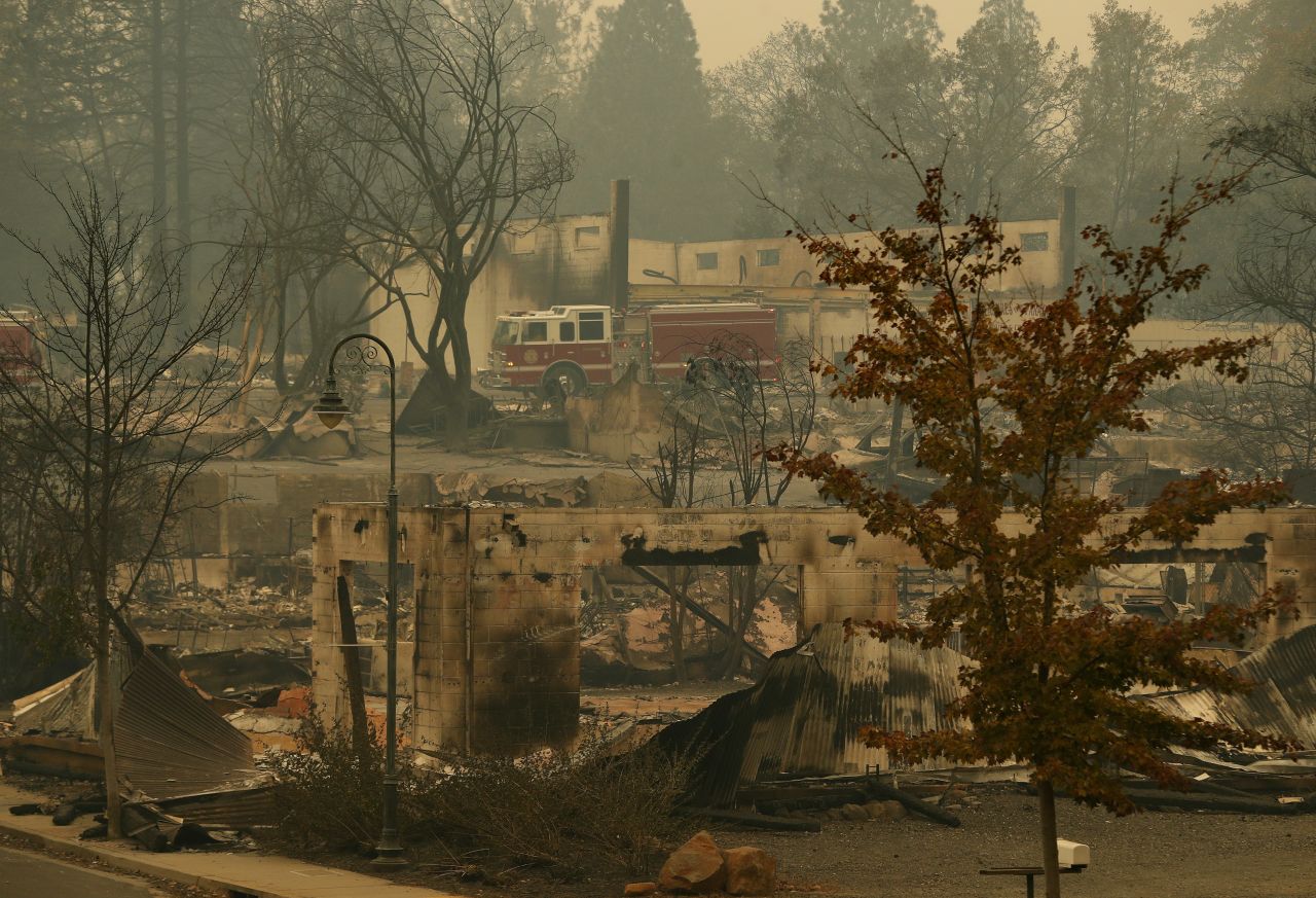 A fire truck drives through part of Paradise on November 13.