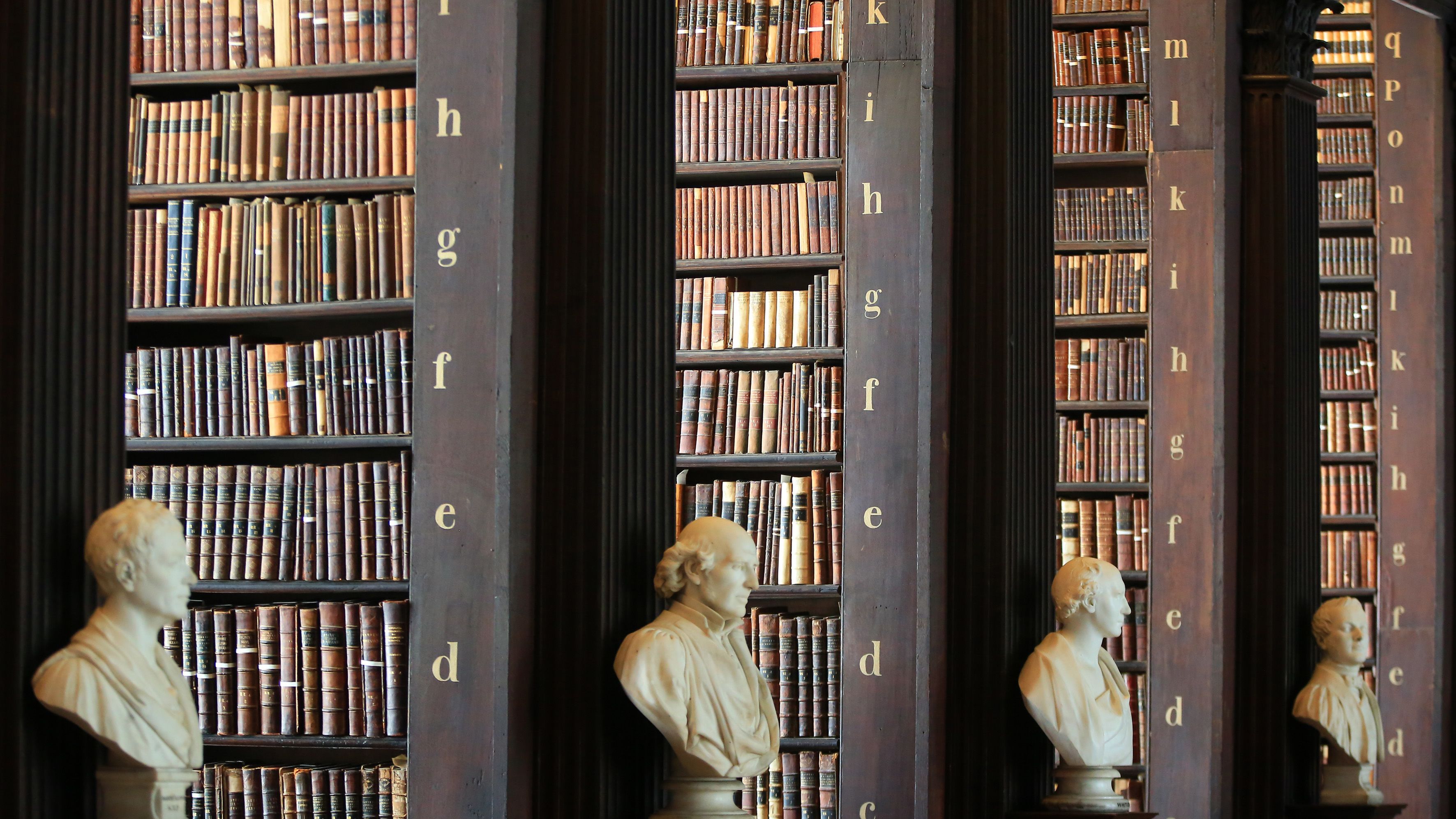 Male busts are displayed inside Trinity College's library in Dublin. 