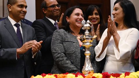 Trump administration regulatory czar Neomi Rao (C) reacts after US President Donald Trump announced his intent to nominate her to fill Brett Kavanaugh's former seat on the D.C. Circuit Federal Court of Appeals during the Diwali ceremonial lighting of the Diya at the White House in Washington, DC, on November 13, 2018. 