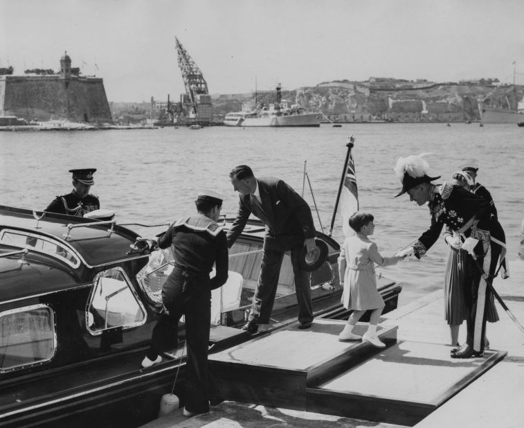 Charles, right, shakes hands with Sir Gerald Creasy, the governor of Malta, as he and the rest of the royal family visit Malta in May 1954.