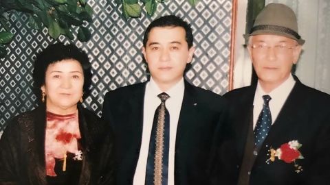 Uyghur journalist Gulchehra Hoja's brother and parents in an undated family photo