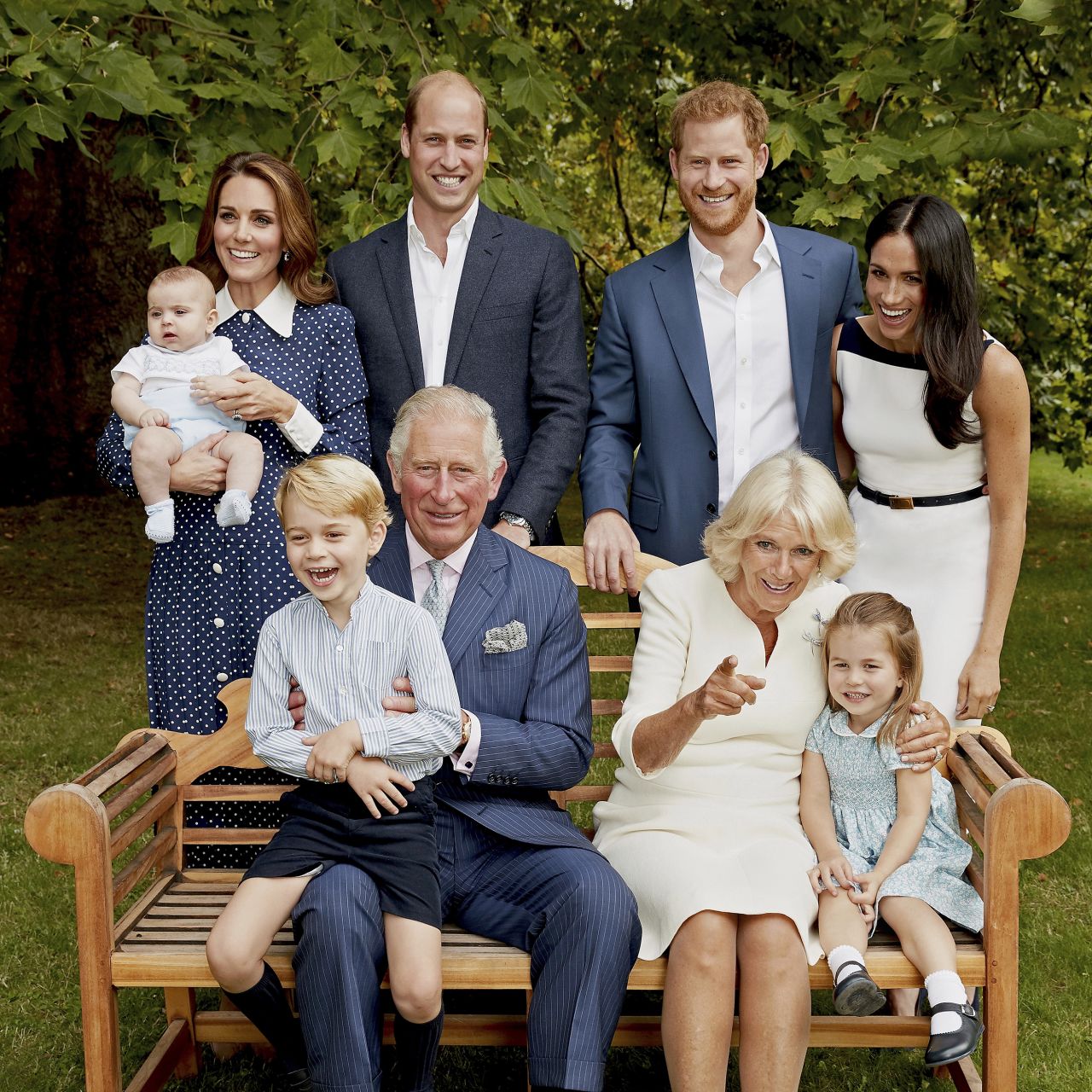 Charles poses with family members for an official portrait to mark his 70th birthday. He's holding his grandson Prince George as Camilla sits next to his granddaughter, Princess Charlotte. In the back row, from left, are his grandson Prince Louis; his daughter-in-law Catherine; his son Prince William; his son Prince Harry; and his daughter-in-law Meghan.